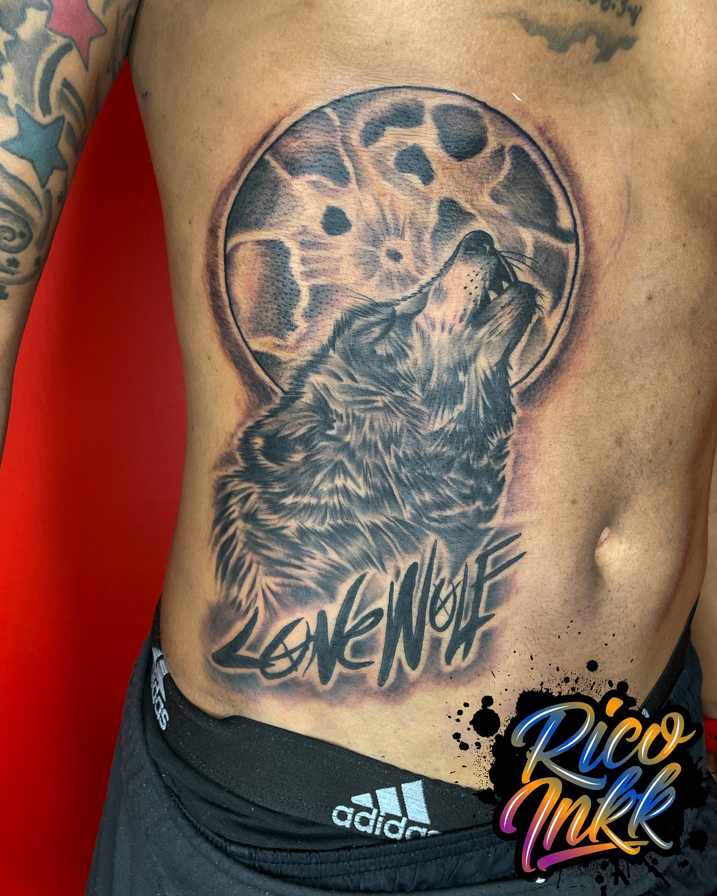 Wolf howling realism tattoo on the ribs by Tattoos By Rico