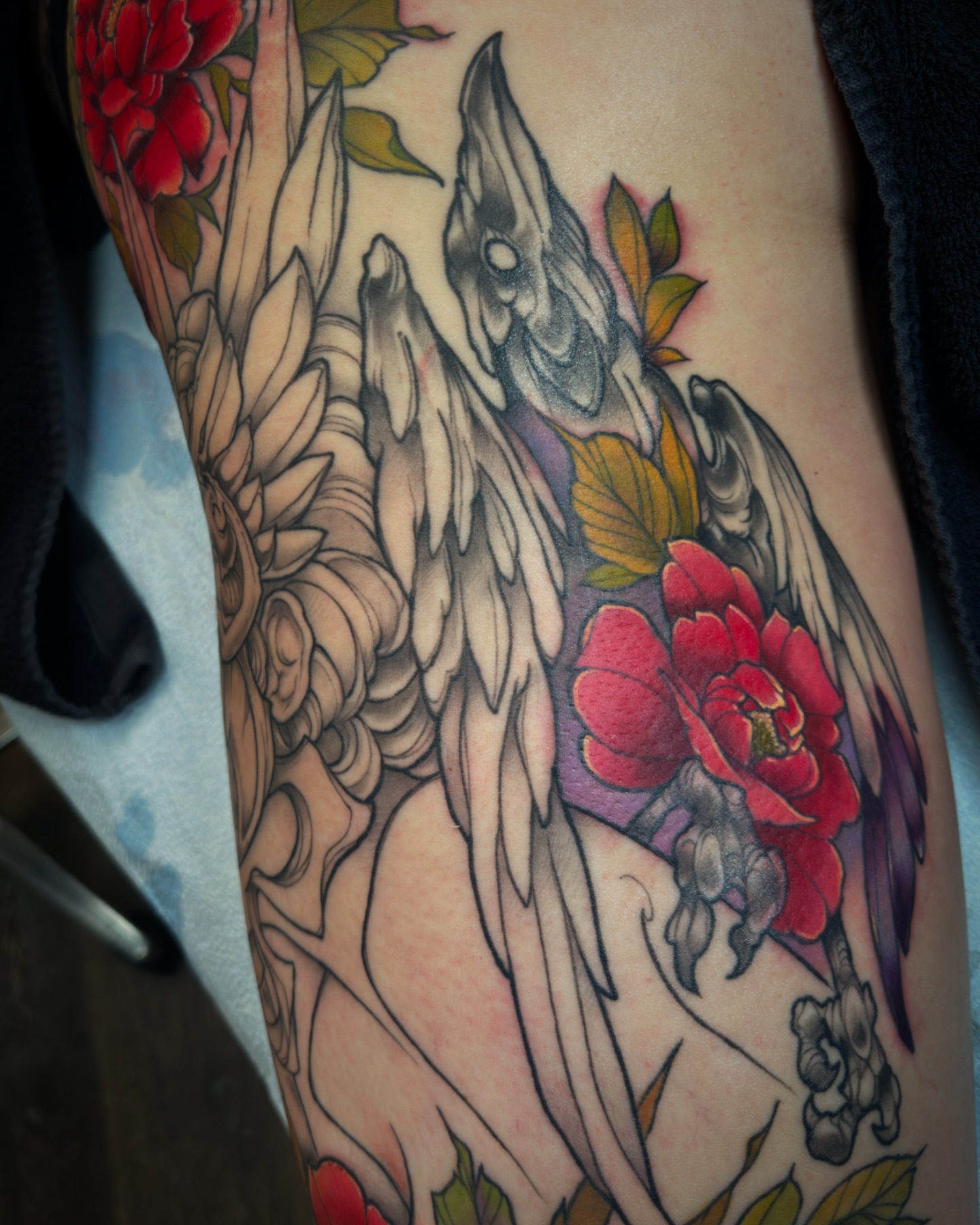 Bird and flowers American traditional tattoo on the forearm by Michael Langdale