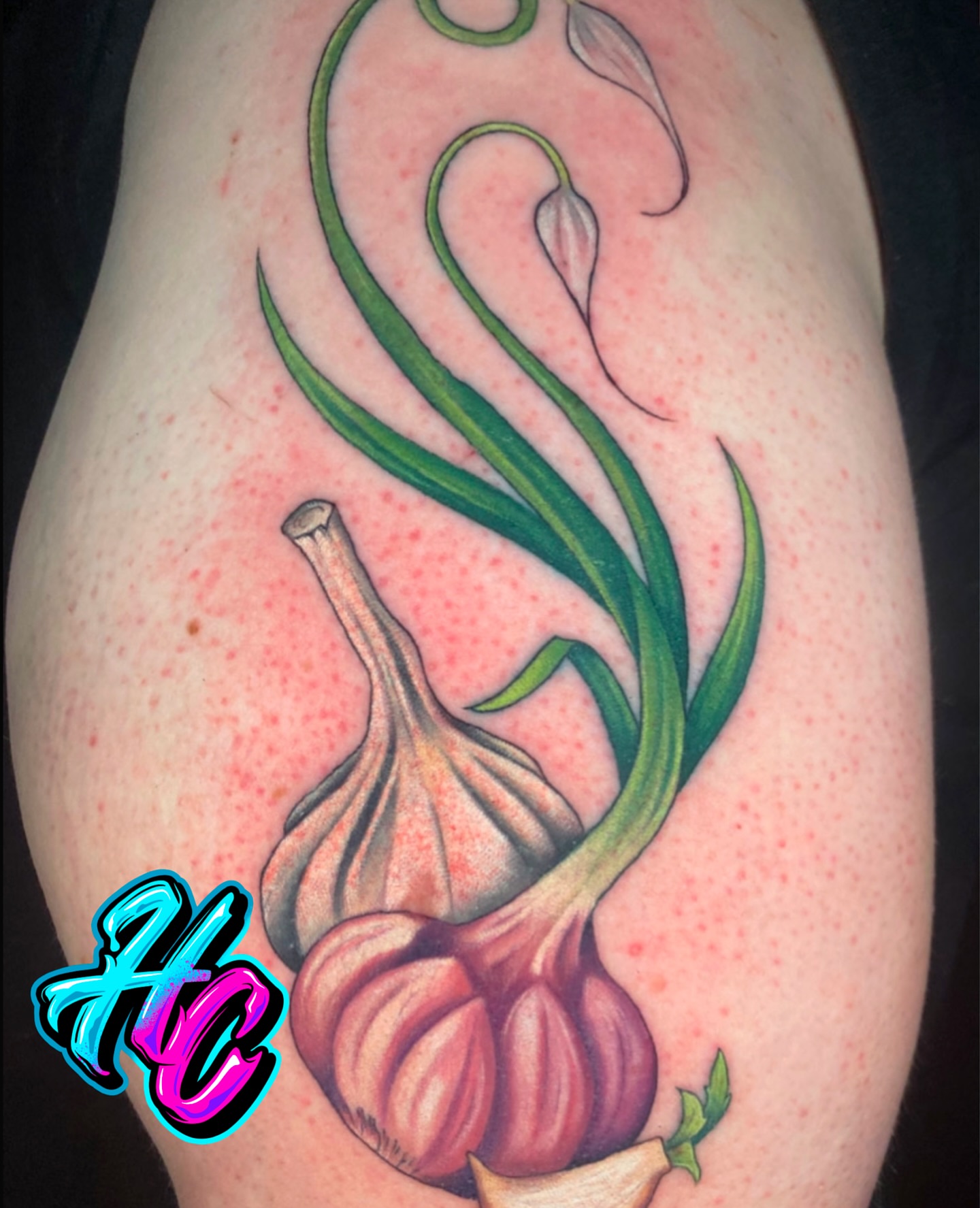 Garlic bulb and leaves realism tattoo on the thigh by Chelsey Moore, Albuquerque, New Mexico