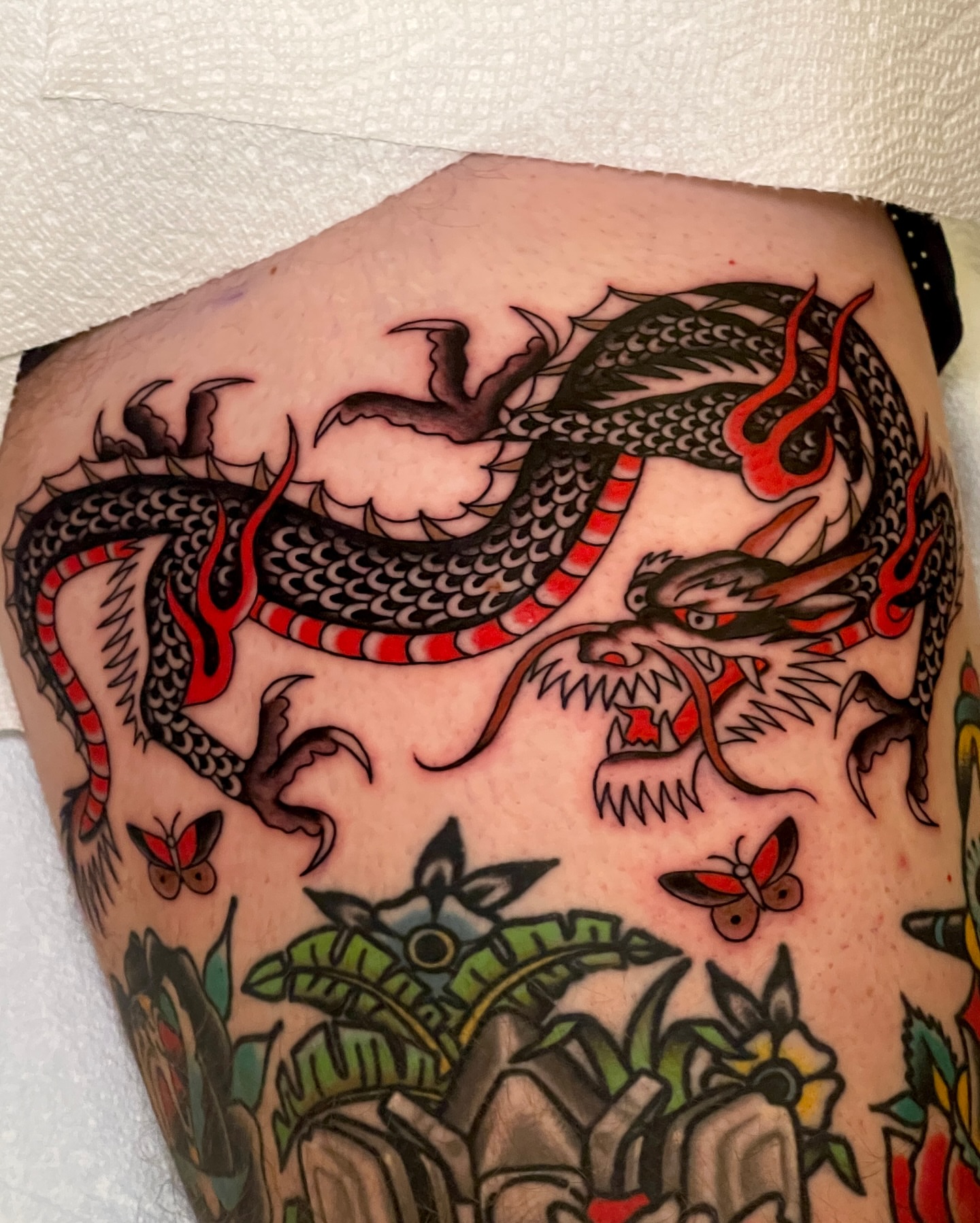 Dragon and butterflies japanese irezumi tattoo on the thigh by Chase Tucker