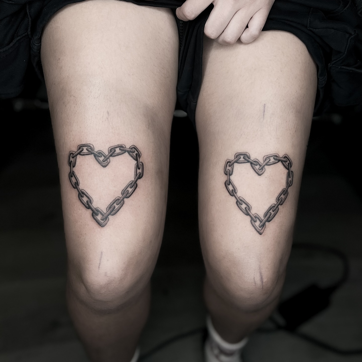 Chain heart black and grey tattoo on the thigh by @sadfoo_tattoo, Austin, Texas