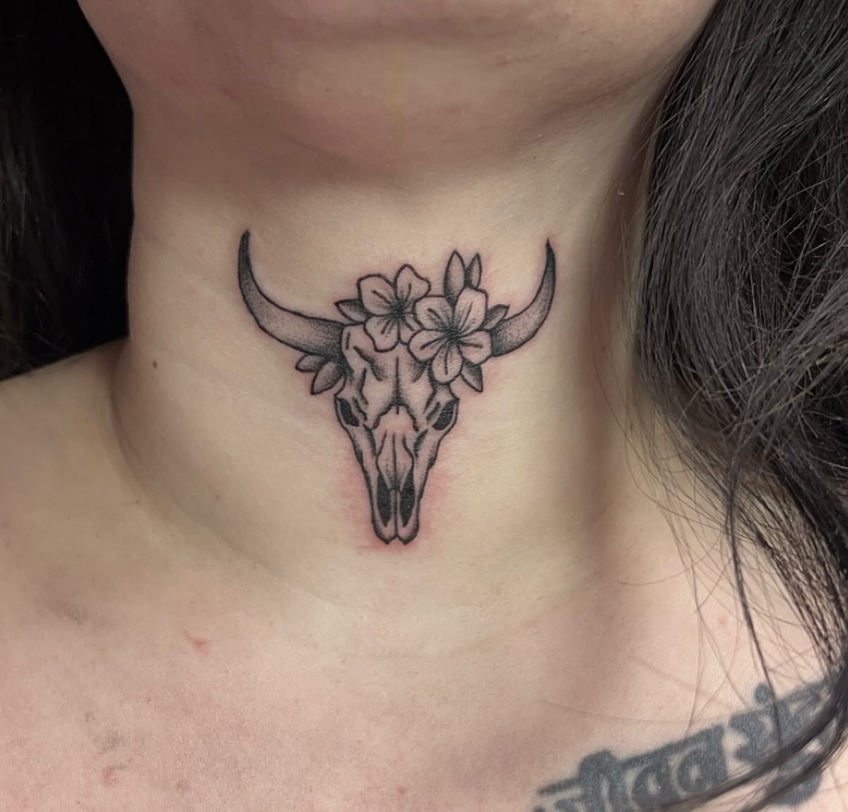 Bull skull with flowers black and grey tattoo on the neck by Erika Donn, Portland, Oregon