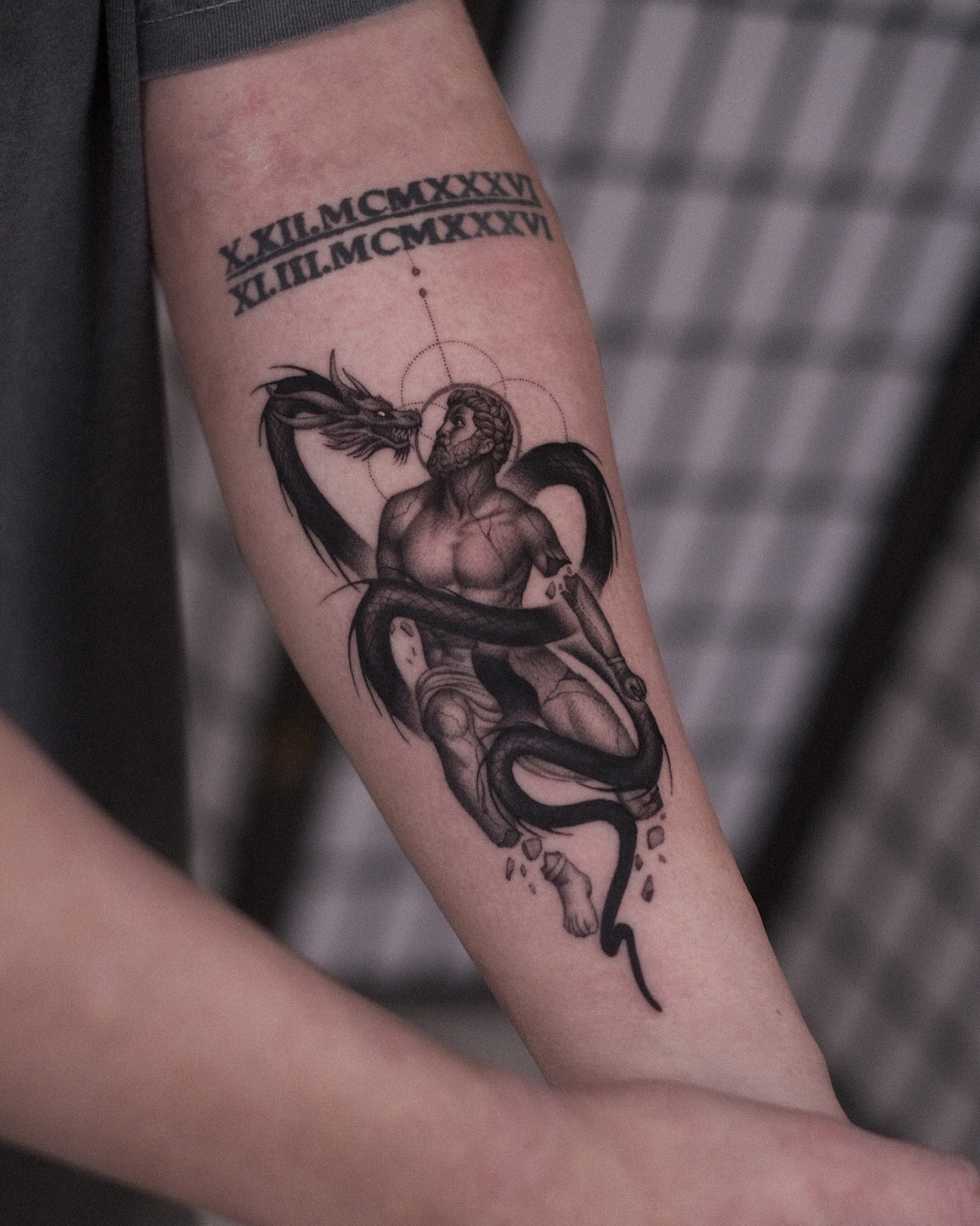 Serpent and man realism tattoo on the forearm by Oleksandr Moroz