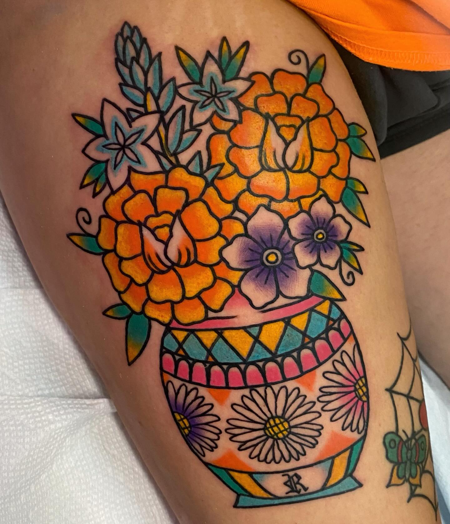 Flower pot new school tattoo on the thigh by Shana