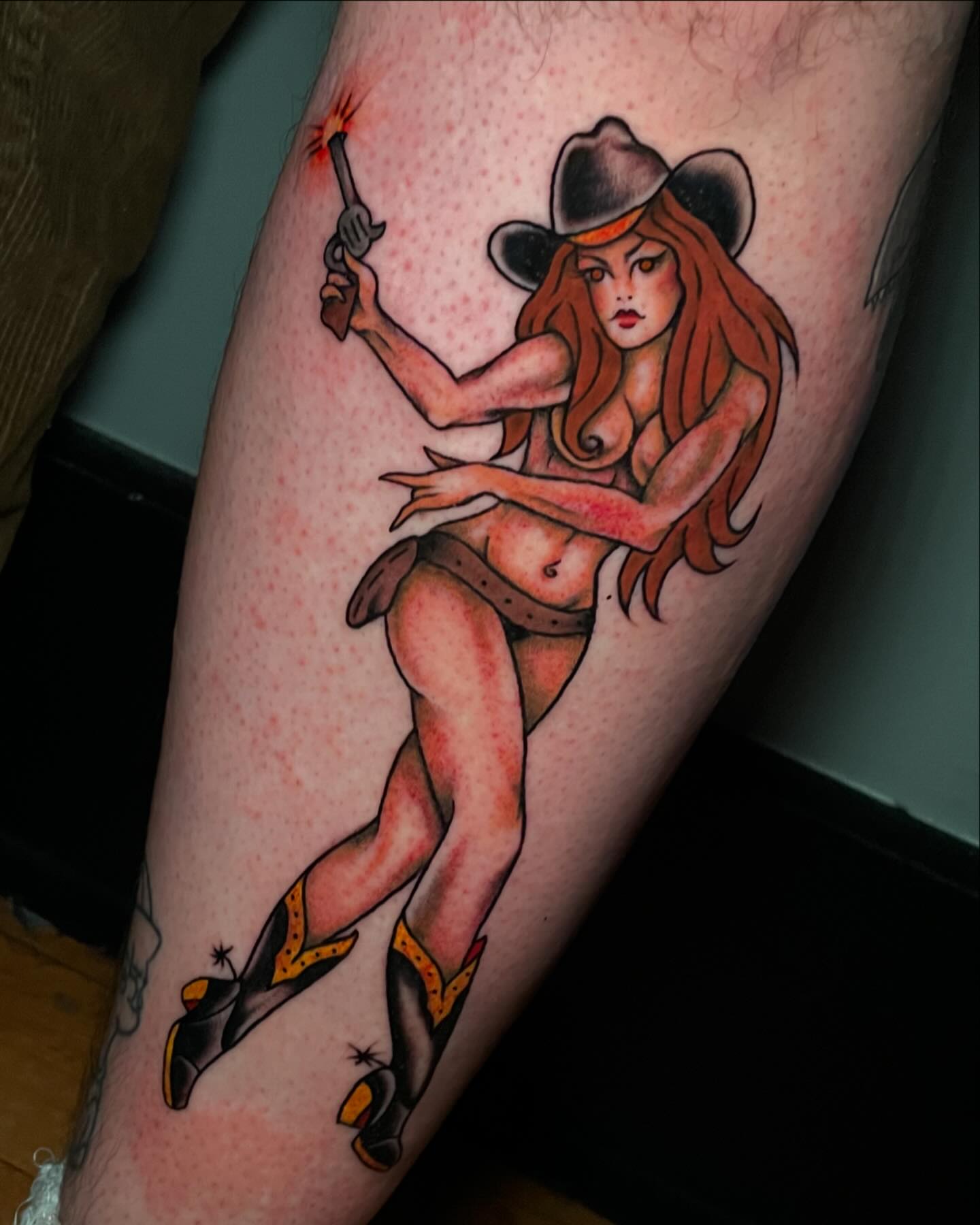 Cowgirl American traditional tattoo on the thigh by Madison ‘Maddog’ Stewart