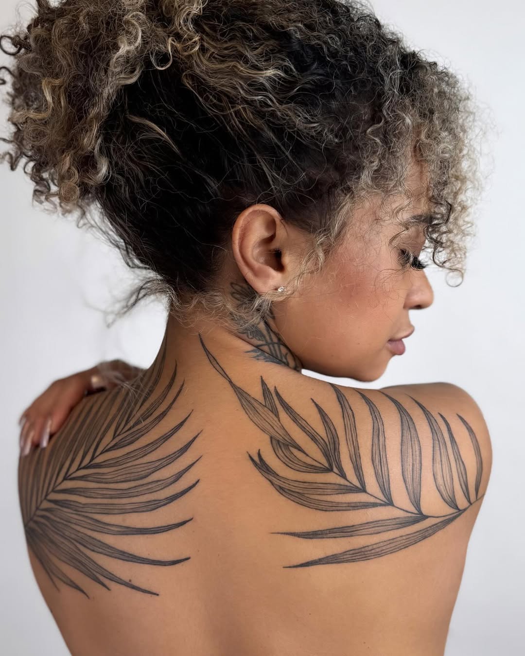 Palm leaves blackwork tattoo on the shoulder by Ink About Me - Amanda’s Fine Lines