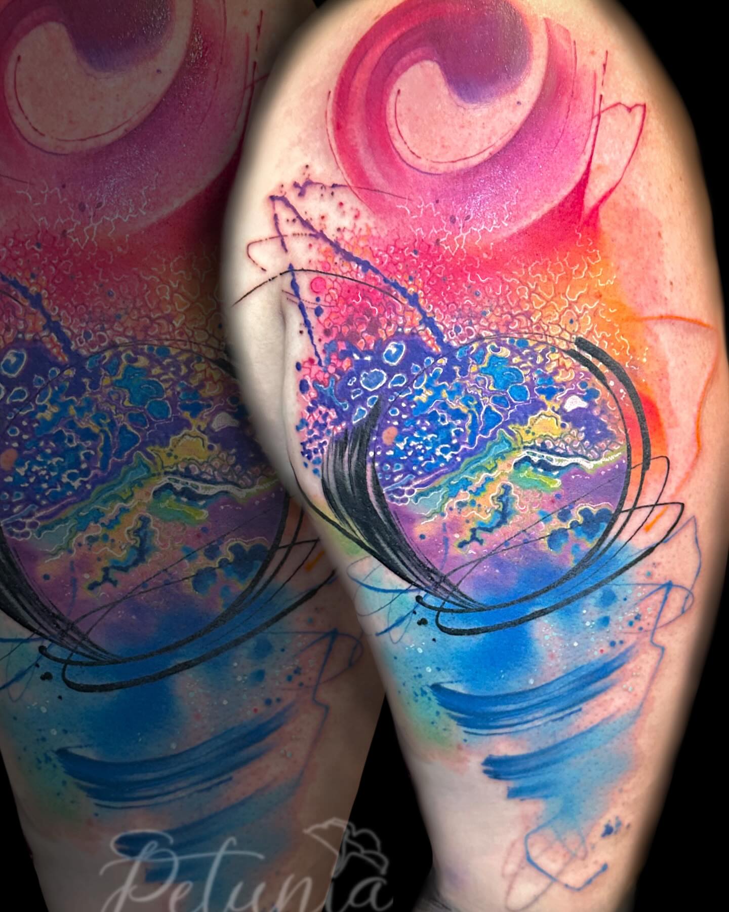 Abstract watercolor watercolor tattoo on the upper arm by Alena Petunia