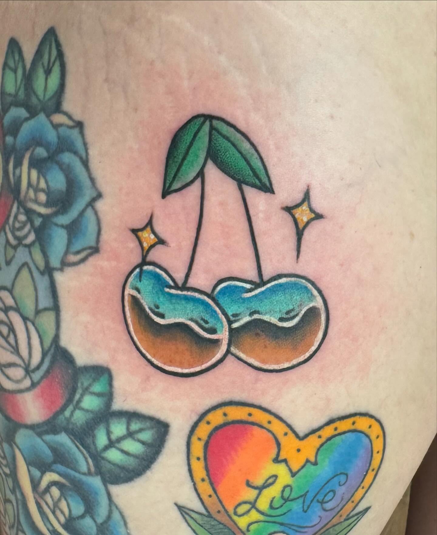 Cherry American traditional tattoo on the thigh by McKenna Chalifoux