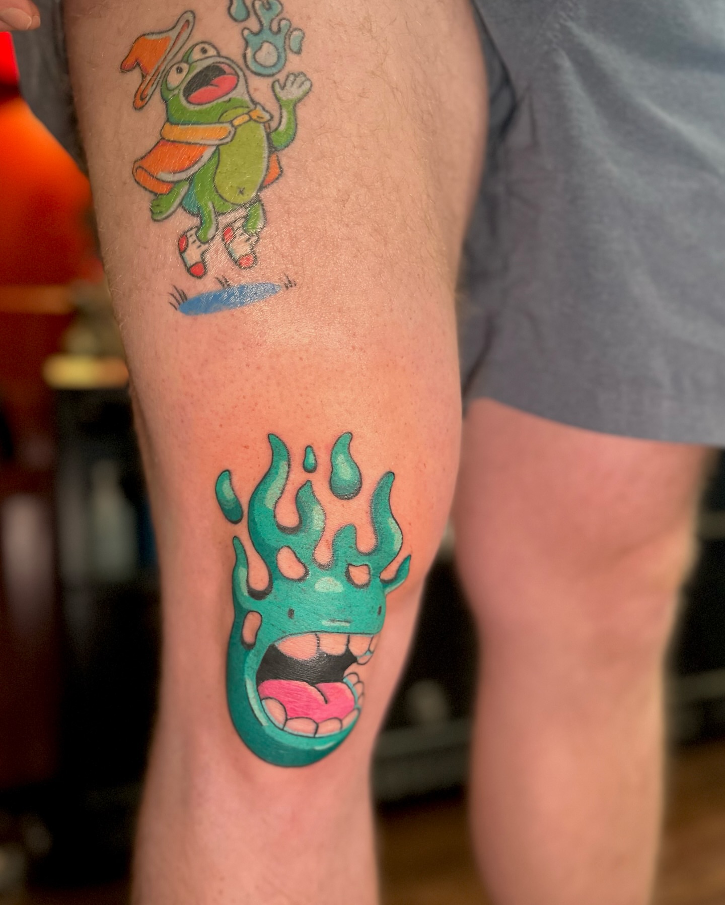 Frog character new school tattoo on the thigh by Kellie Burch