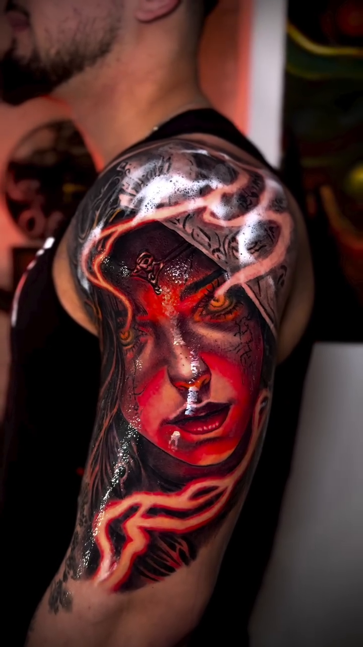 Woman's face with hood realism tattoo by Tony Ink