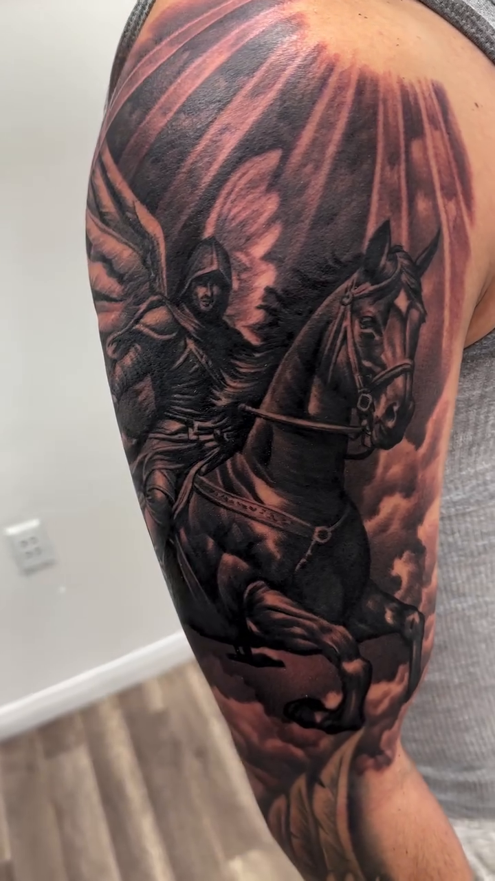Angel on horseback with radiant light realism tattoo by Joshua ramirez, Montebello, California