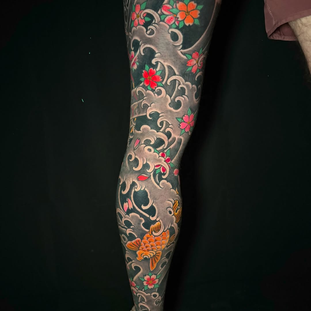 Koi fish and cherry blossoms Japanese tattoo on the forearm by Leif Hansen