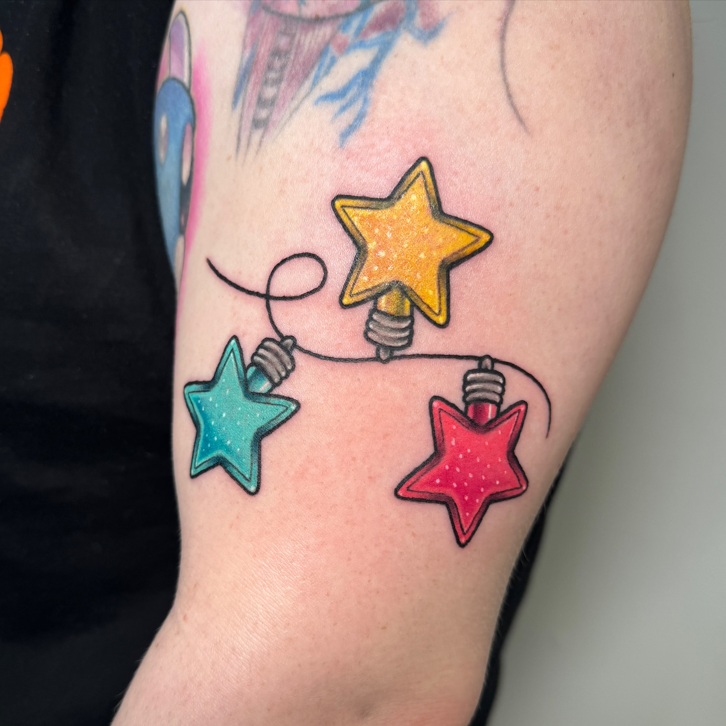 Star string lights dotwork tattoo on the forearm by Ashley Rose - Minnesota Tattoo Artist