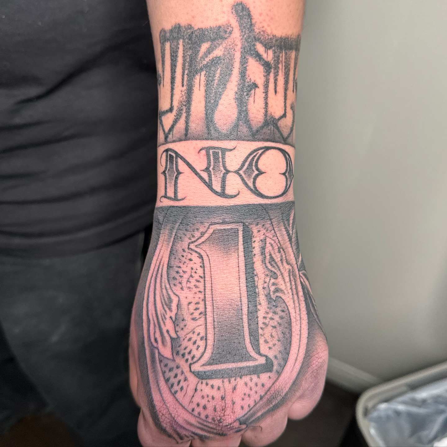 Number one black and grey tattoo on the hand by Yari, Los Angeles, California