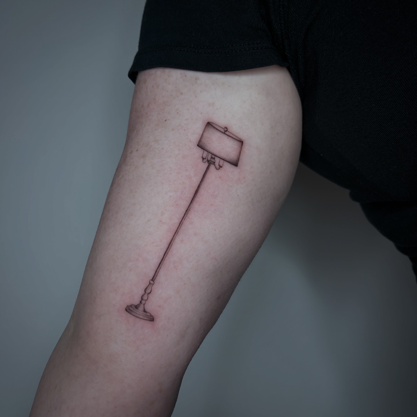 Lamp black and grey tattoo on the forearm by bre