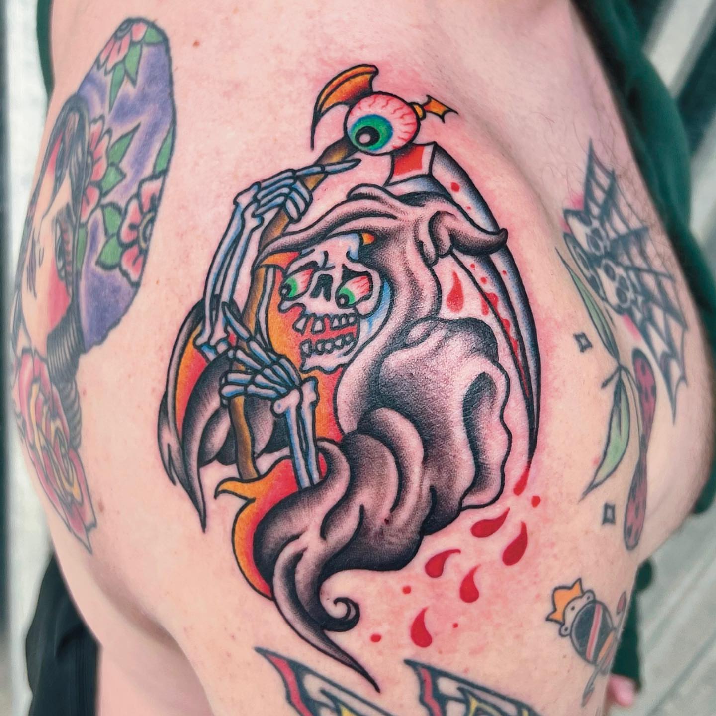 Skeleton with eye American traditional tattoo on the thigh by Carson Smith, Chandler, Arizona