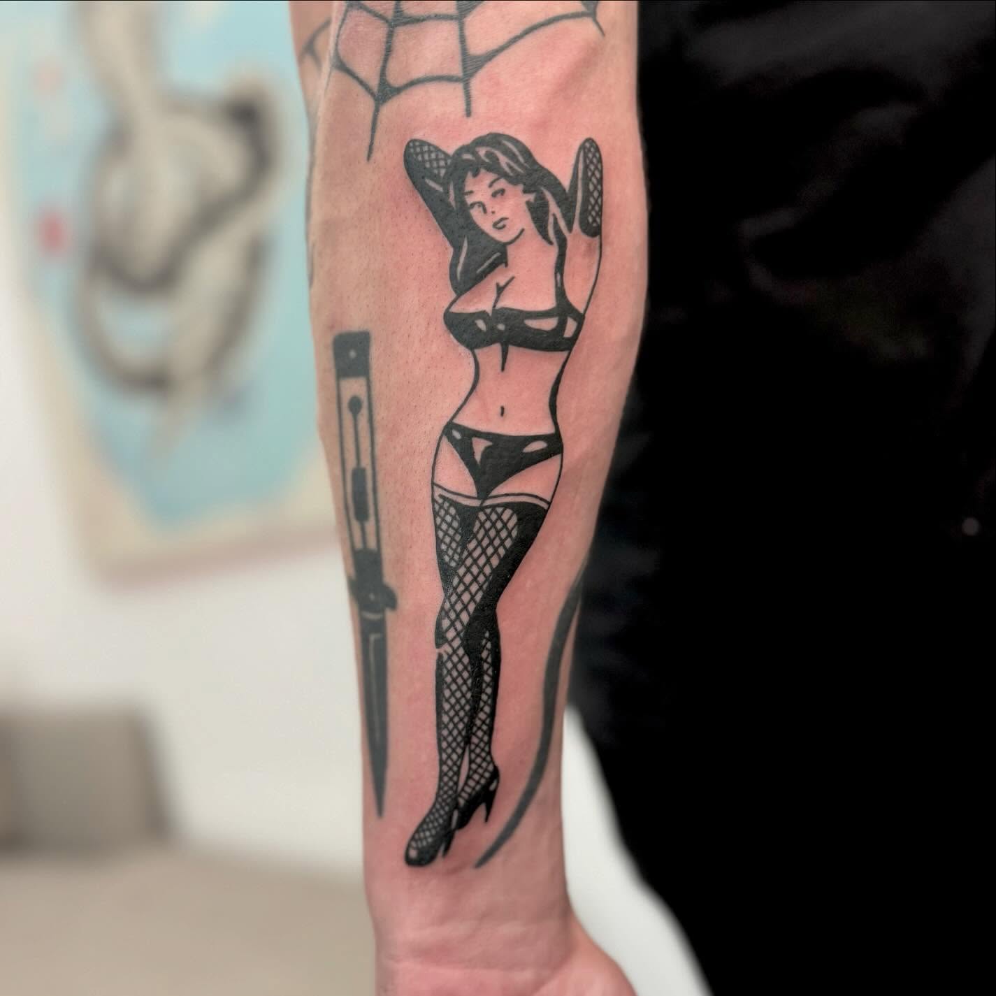 Woman in lingerie black and grey tattoo on the forearm by Han shinko, Portland, Oregon