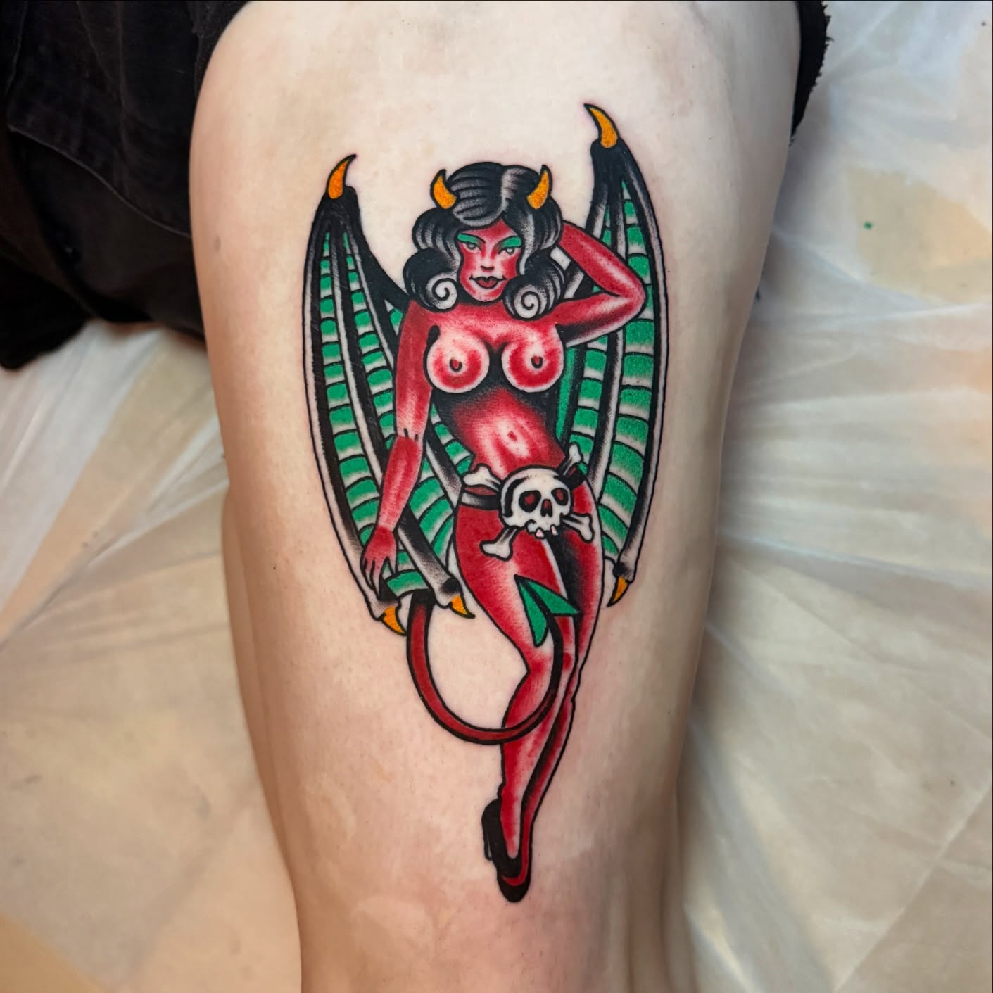 Devil pin-up American traditional tattoo on the thigh by Angus Perfect, Philadelphia, Pennsylvania