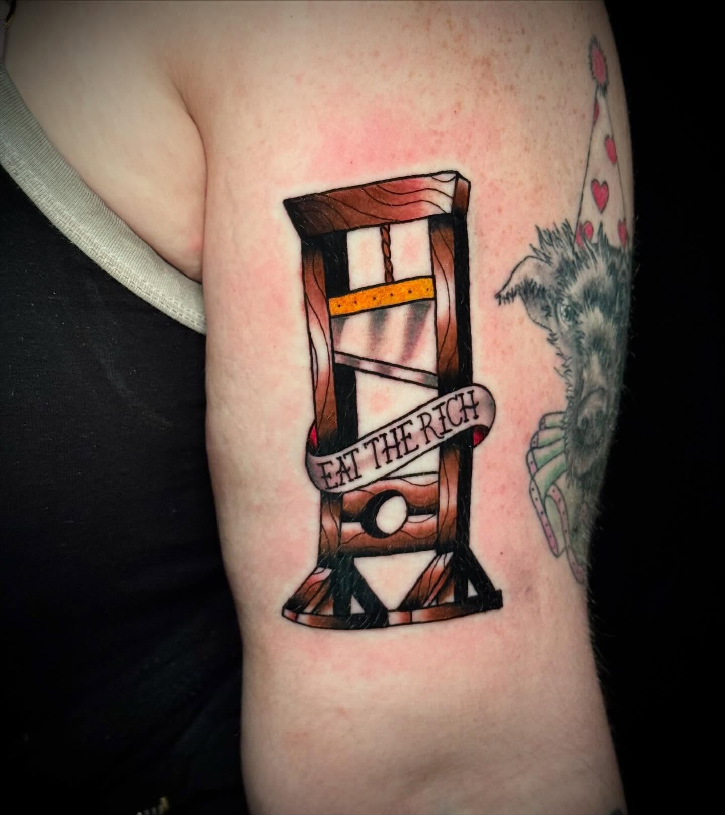 Chair with banner geometric tattoo on the forearm by Jeremy Carson