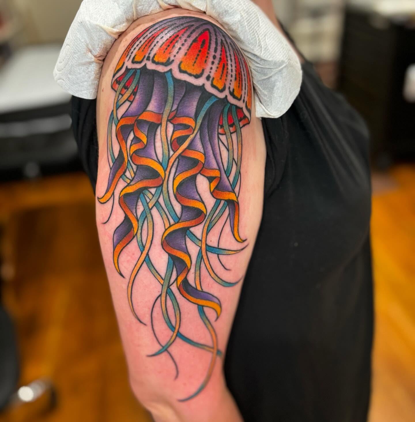 Jellyfish new school tattoo on the forearm by Cody Collins