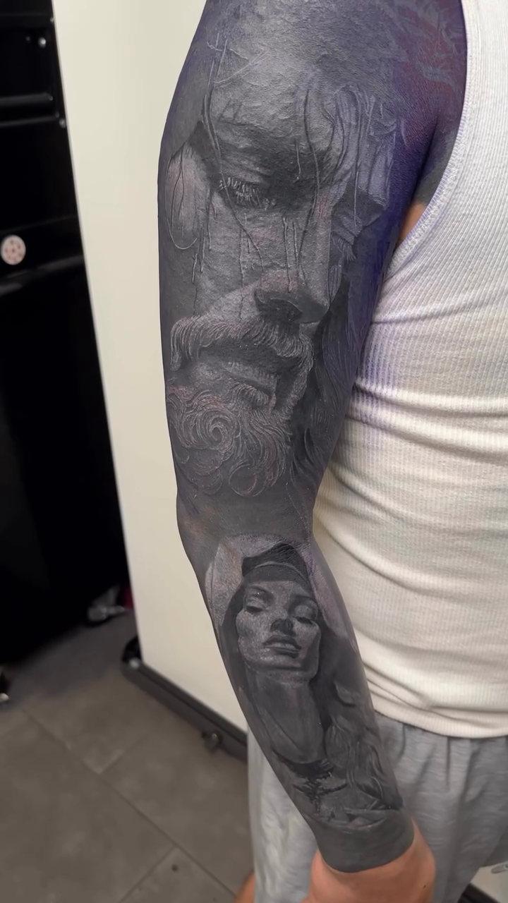 Tattoo by @vudoo_tattoo — realism, black_and_grey