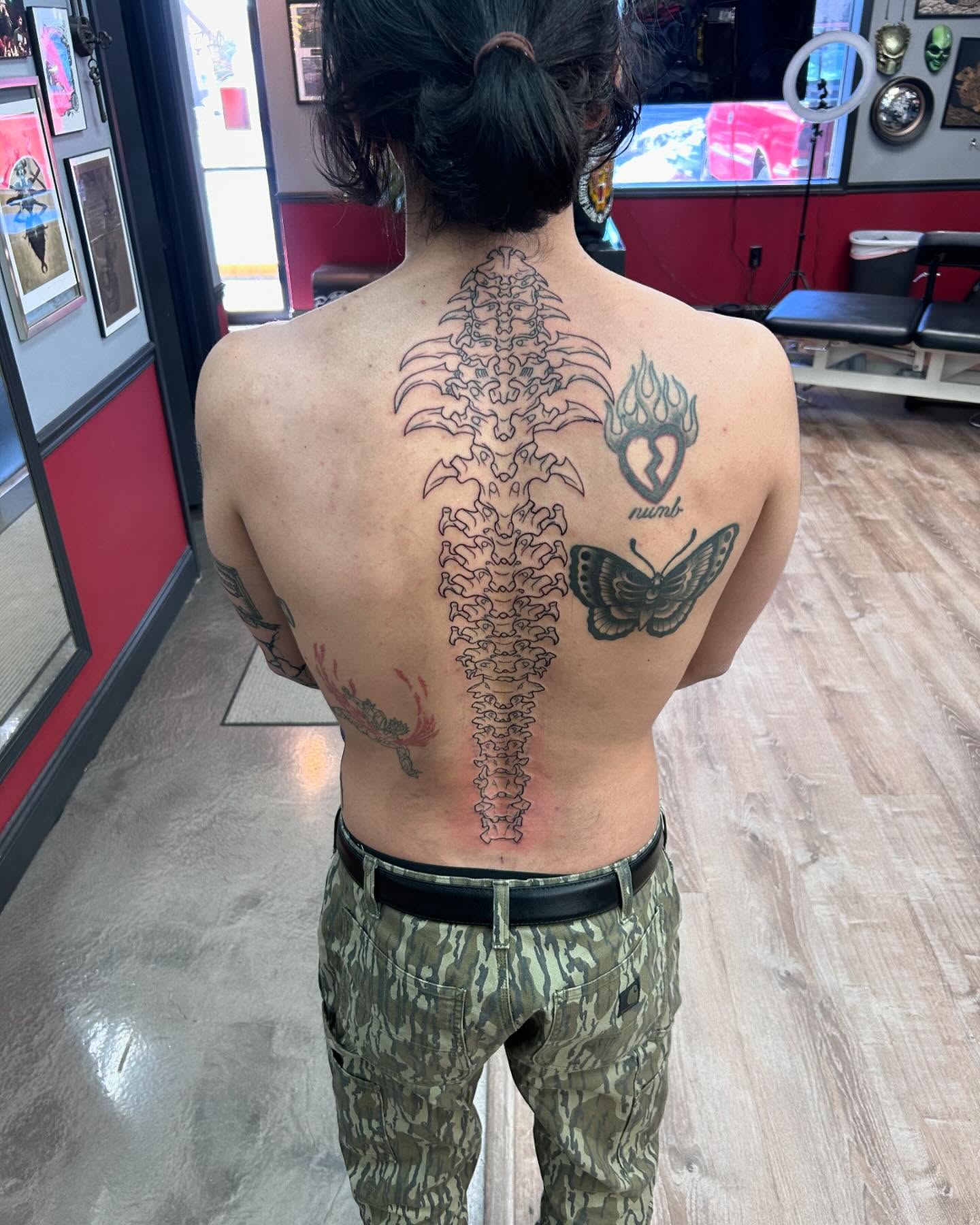 Spine black and grey tattoo on the back by Ricardo (RJ)