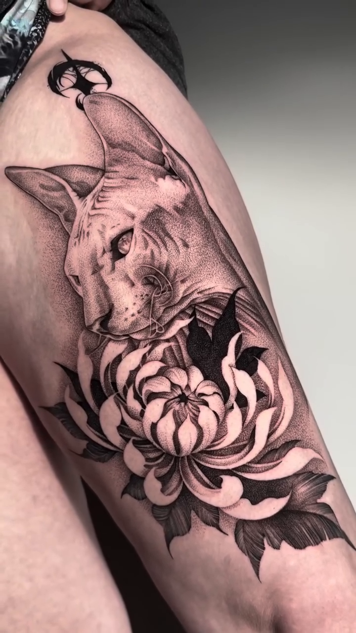 Tattoo by @dragonink.tattoos — realism, black_and_grey