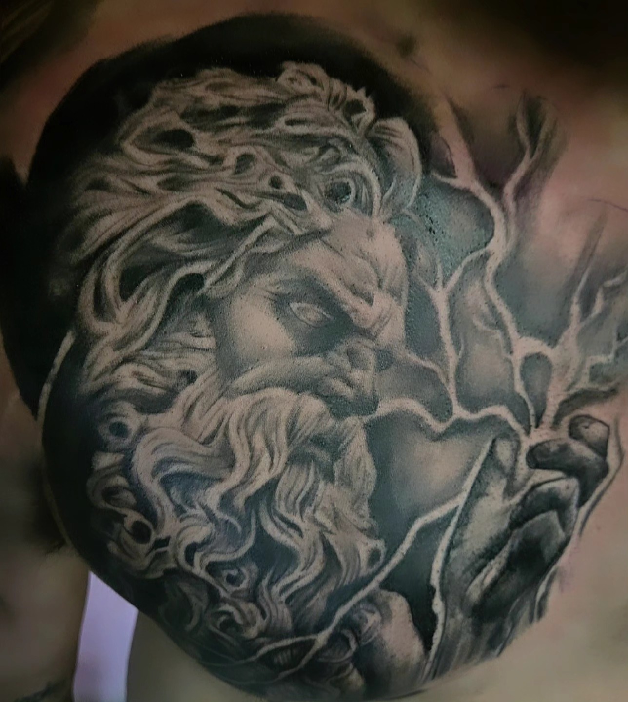 Tattoo by @goth_ross_502 — black_and_grey, realism