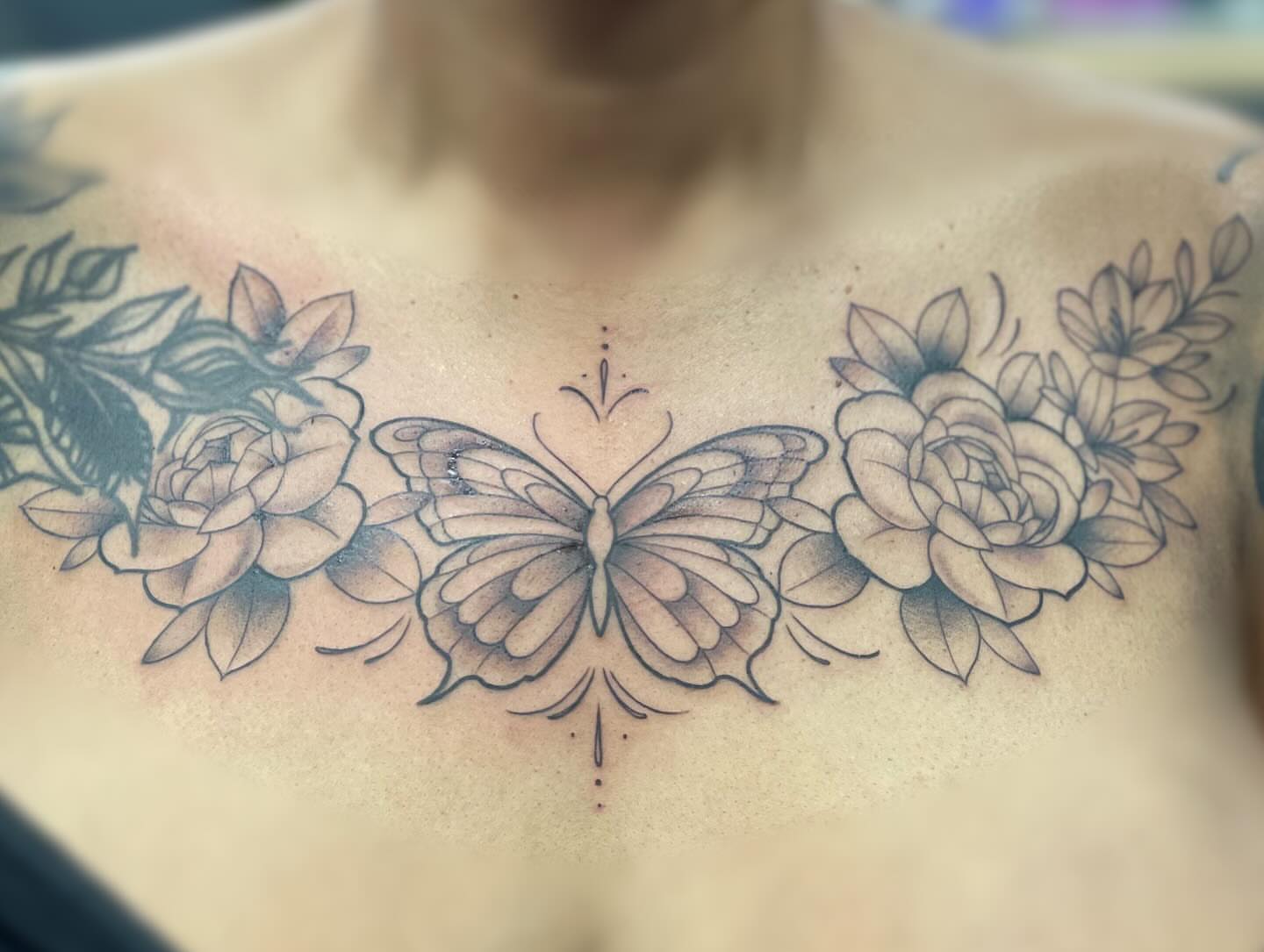 Butterfly and flowers dotwork tattoo on the chest by ๐ณ๐๐๐๐ข ๐ต๐๐๐๐๐๐