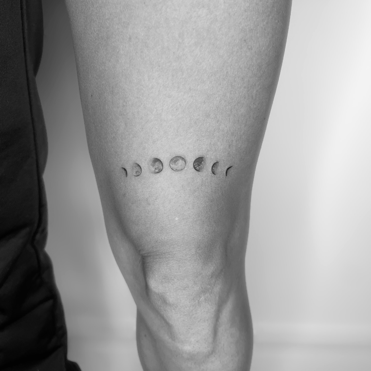 Moon phases dotwork tattoo on the calf by Marisa Martello, Nashville, Tennessee