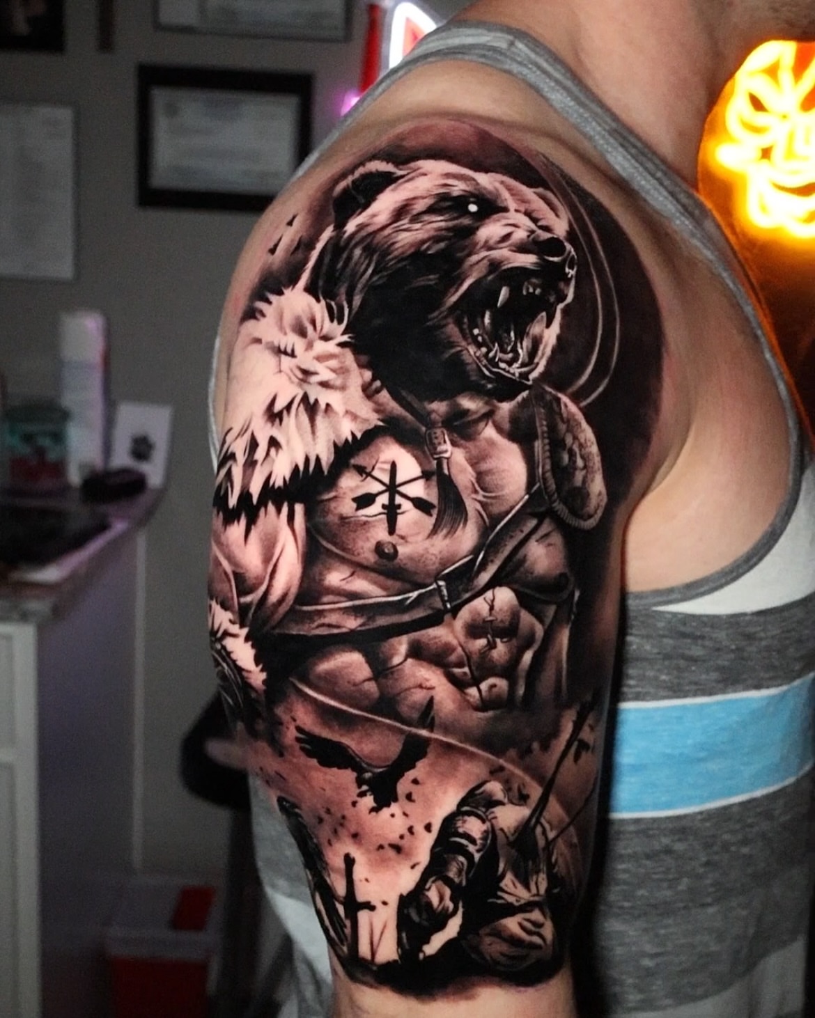 Bear and warrior realism tattoo on the shoulder by Jesus Bravo