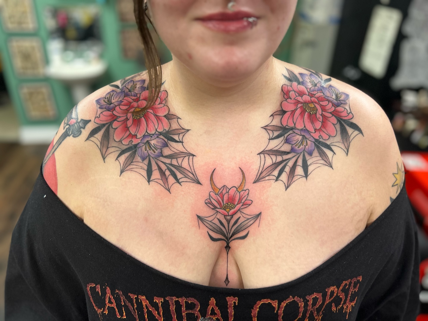 Floral bat wings American traditional tattoo on the chest by Patricia Cunningham