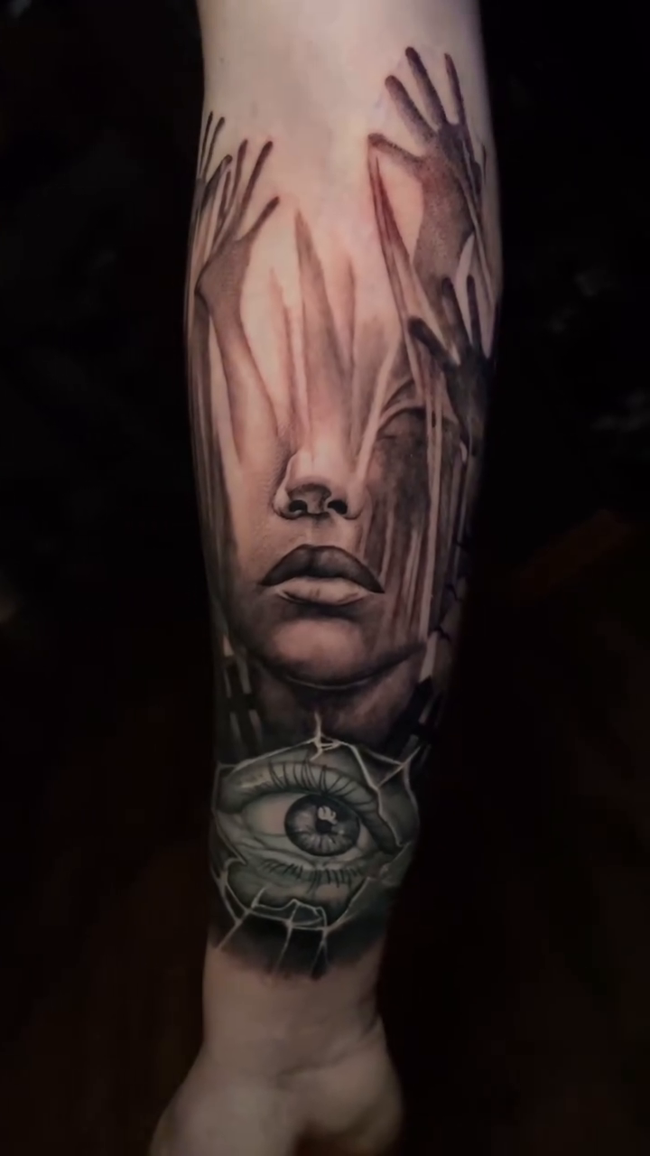 Haunting face and eye on leg realism tattoo on the forearm by Zachary Hayden