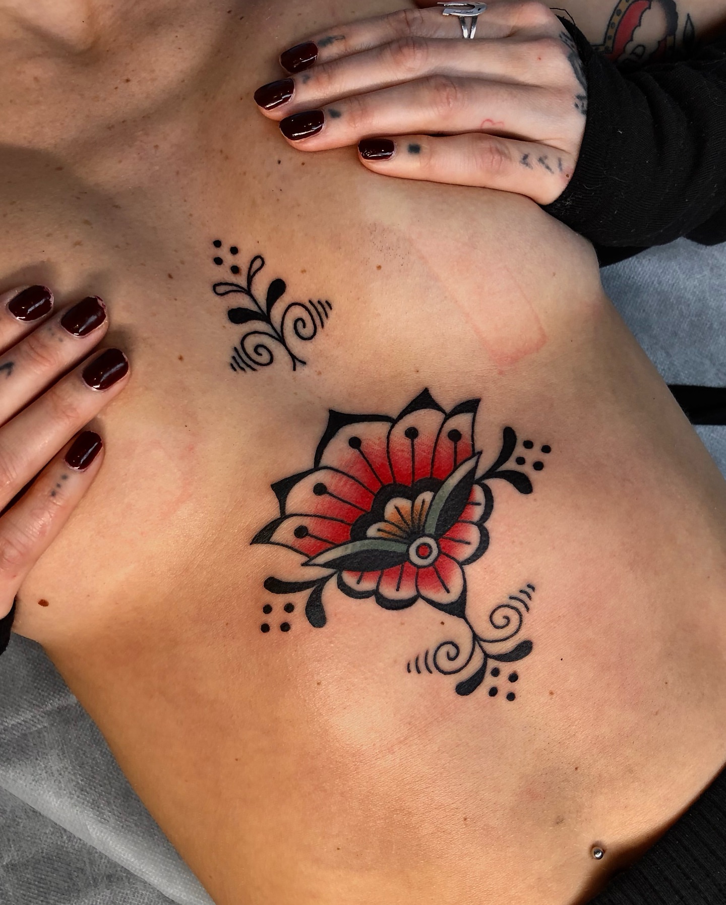 Flower American traditional tattoo on the back by EVA Traditional Tattoos