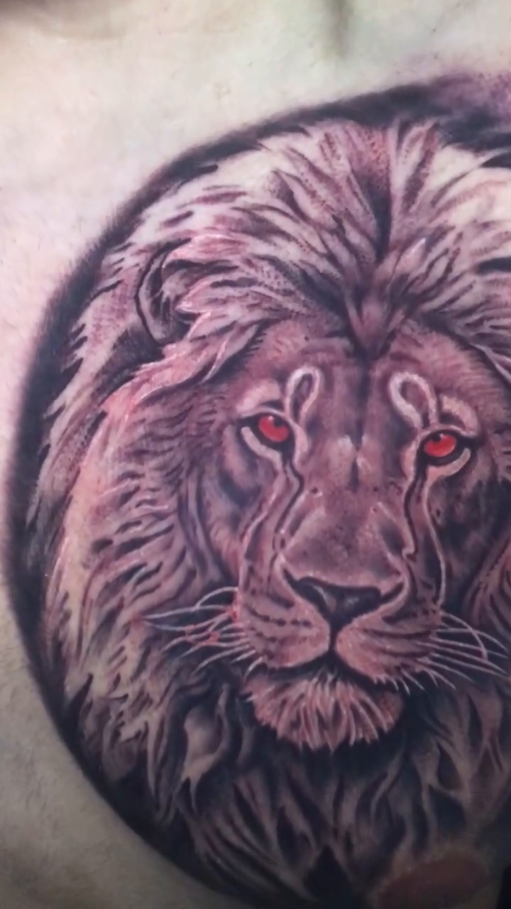 Lion portrait realism tattoo by Jose Calderon