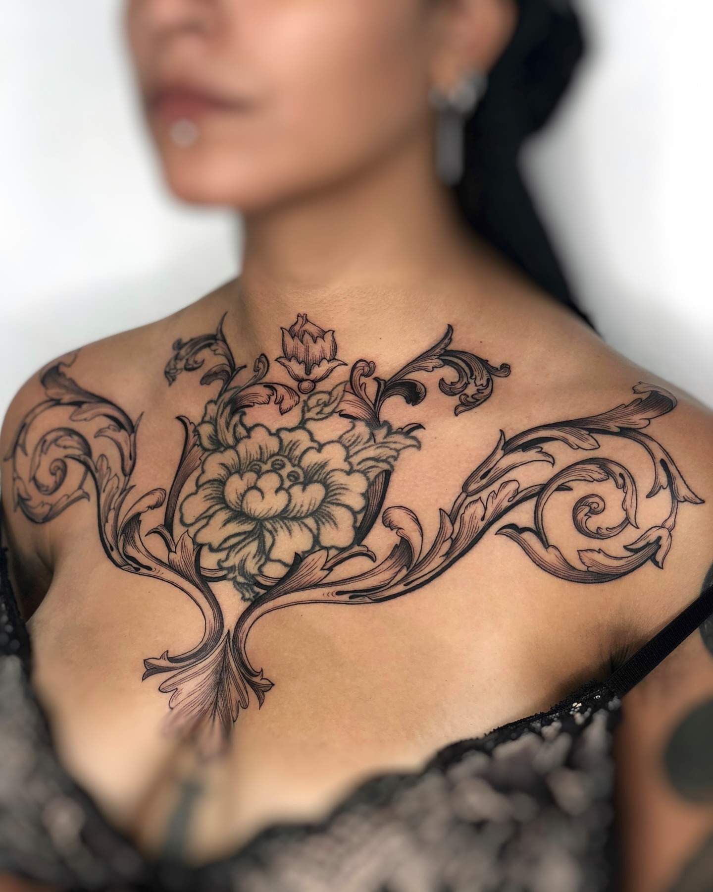 Floral design ornamental tattoo on the chest by Jorge Nox