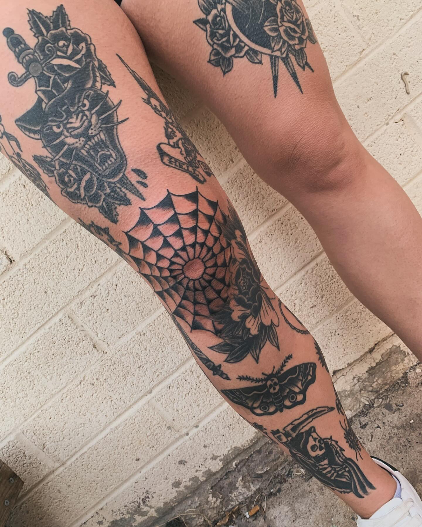 Spiderweb and roses geometric tattoo on the forearm by Chrissie