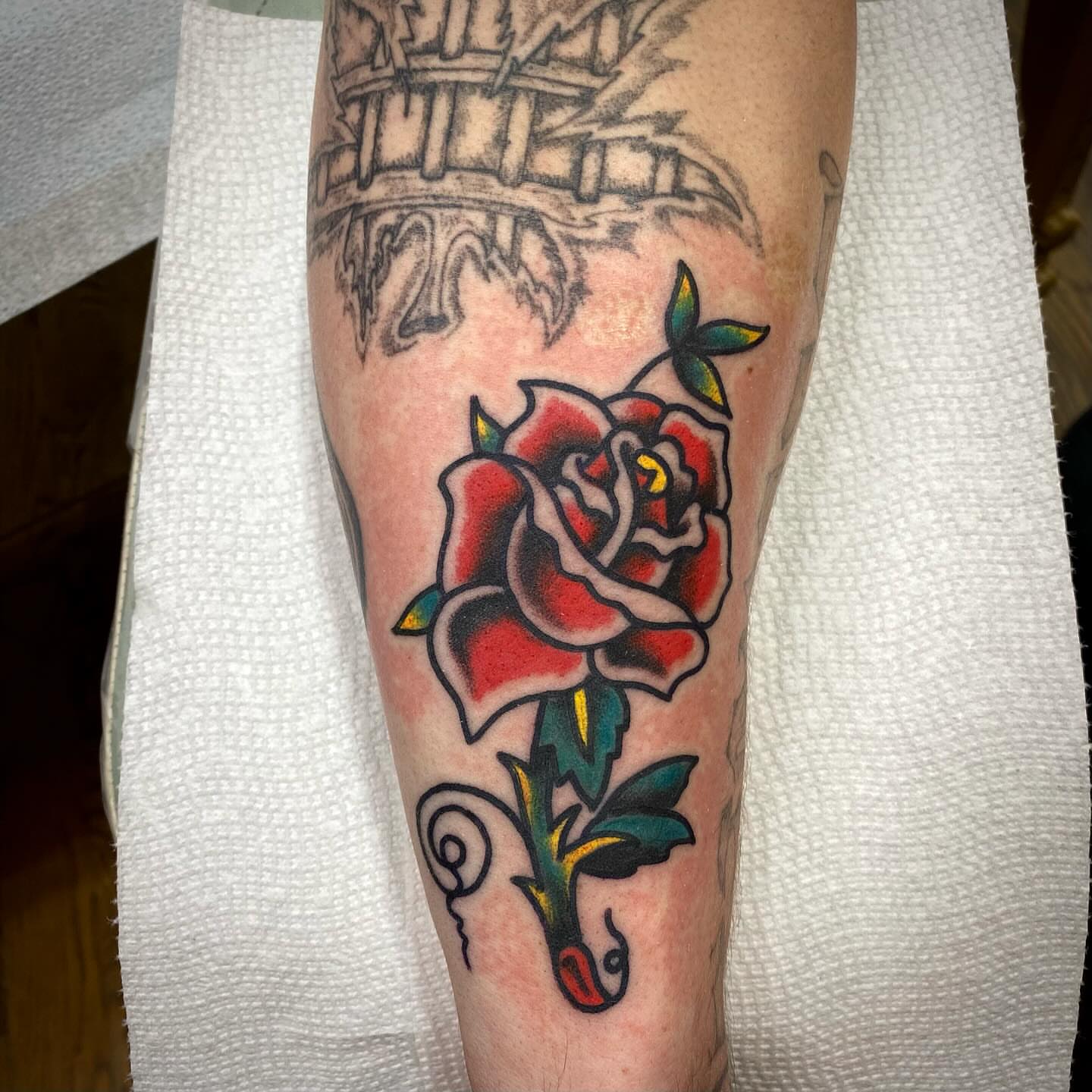 Red rose American traditional tattoo on the forearm by Jack, Knoxville, Tennessee