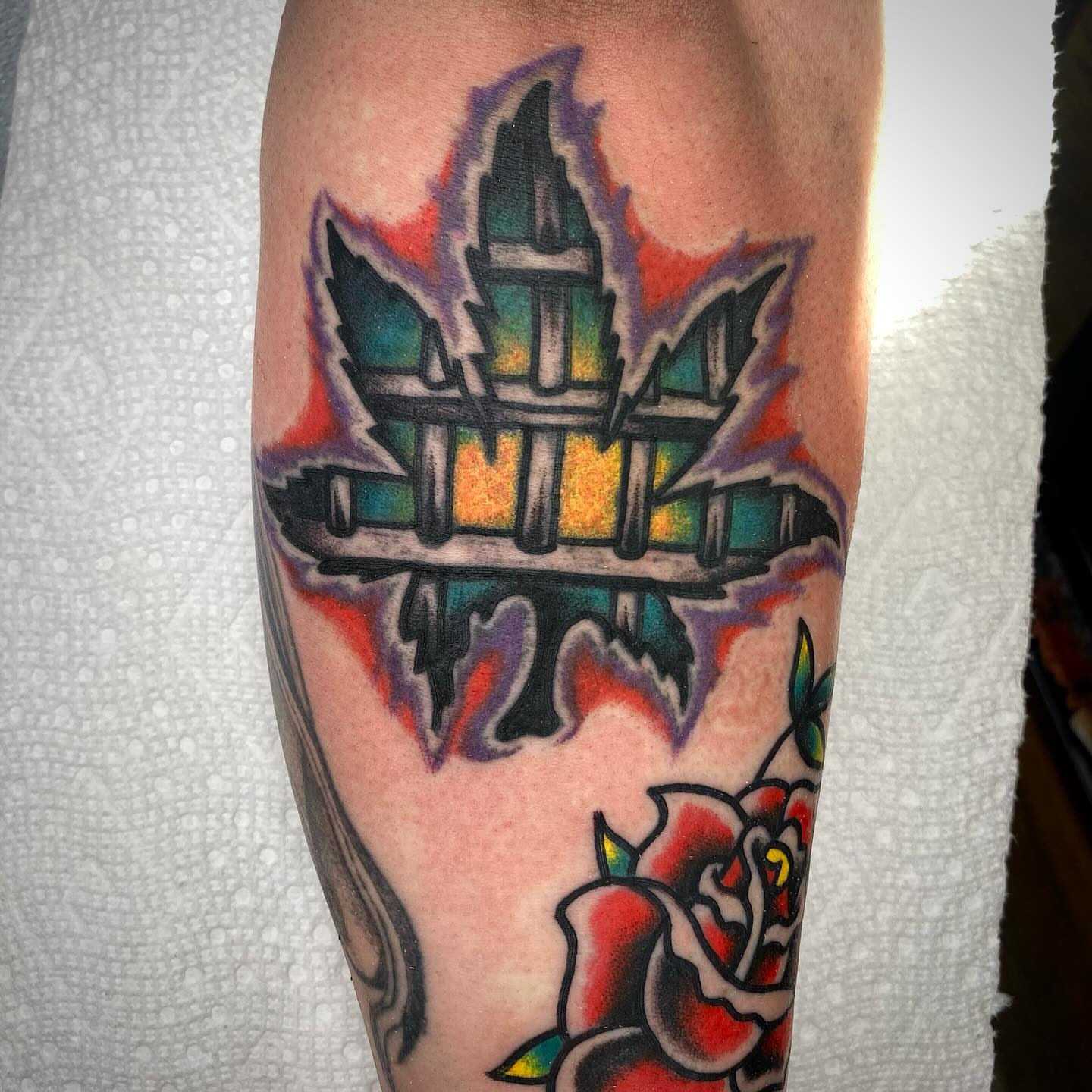 Maple leaf and fence American traditional tattoo on the forearm by Jack, Knoxville, Tennessee