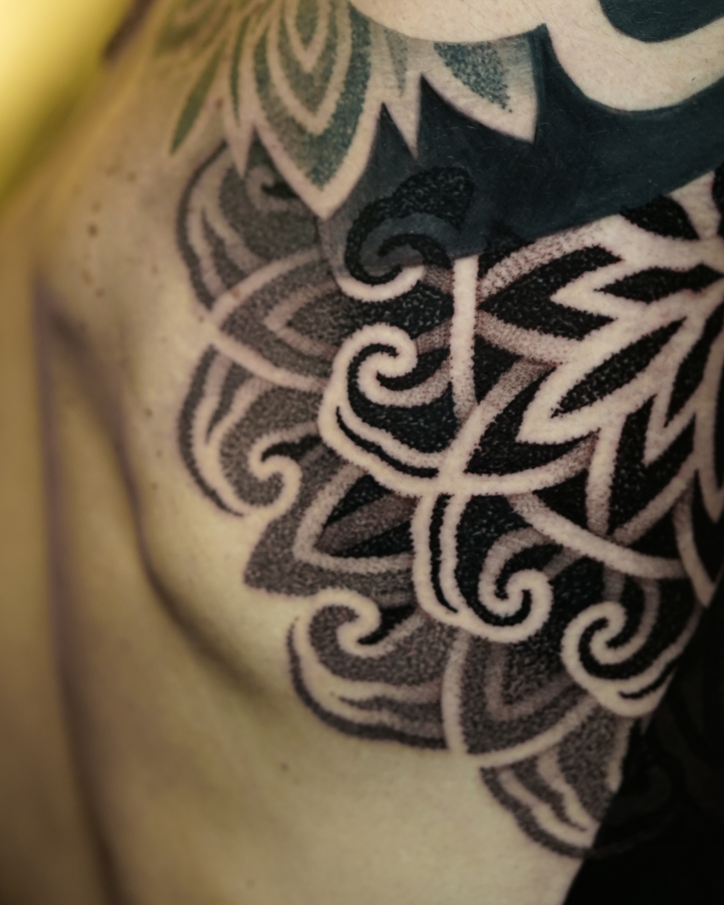 Abstract swirls geometric tattoo on the shoulder by Luis Gil