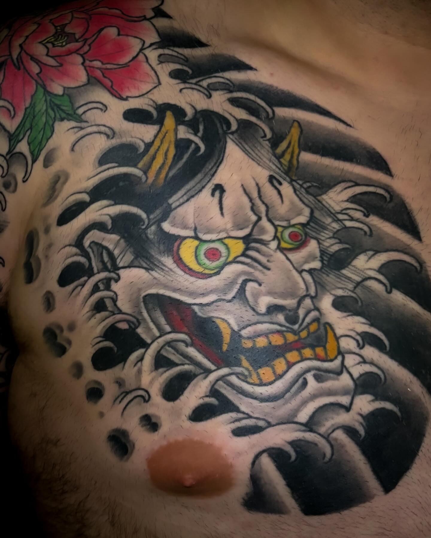 Japanese mask japanese irezumi tattoo on the chest by Adam Underwood, Minneapolis, Minnesota
