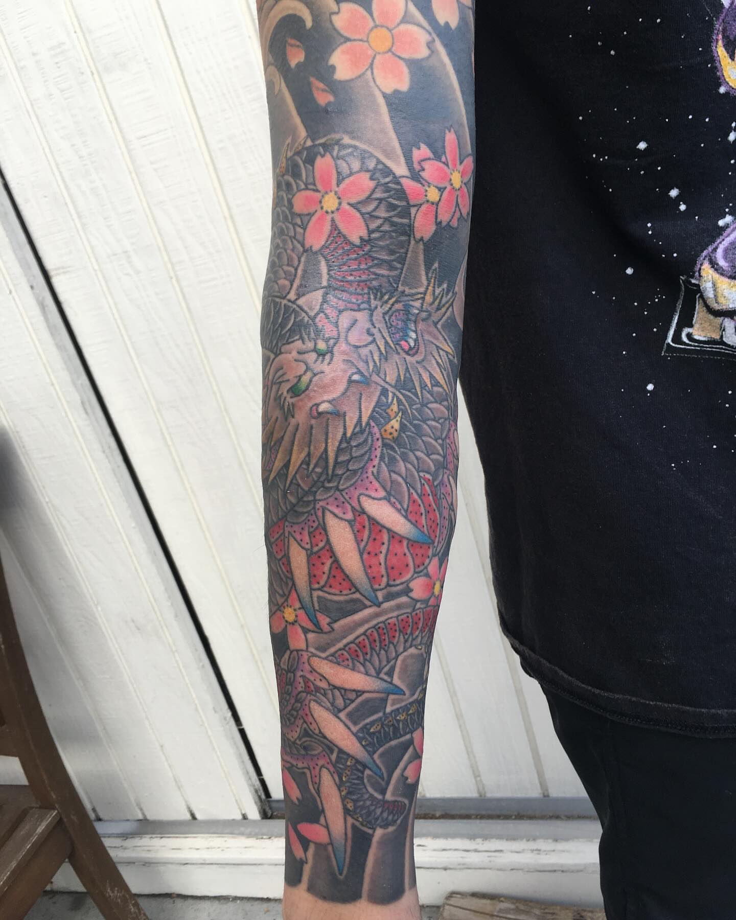 Dragon and flowers japanese irezumi tattoo on the forearm by Ei Horimiya Omiya