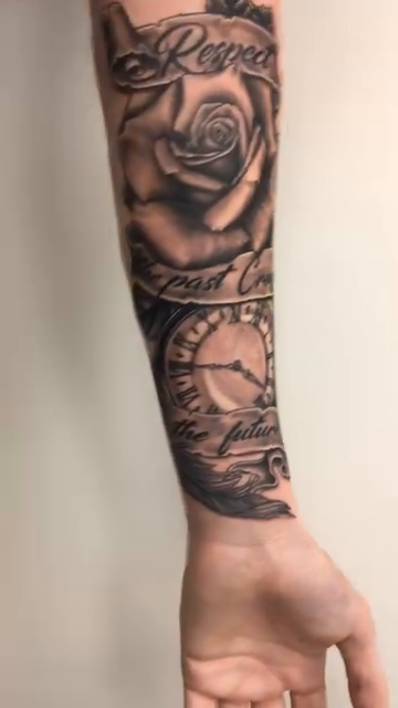 Rose, clock, and lettering Chicano tattoo on the forearm by Joshua Shawn