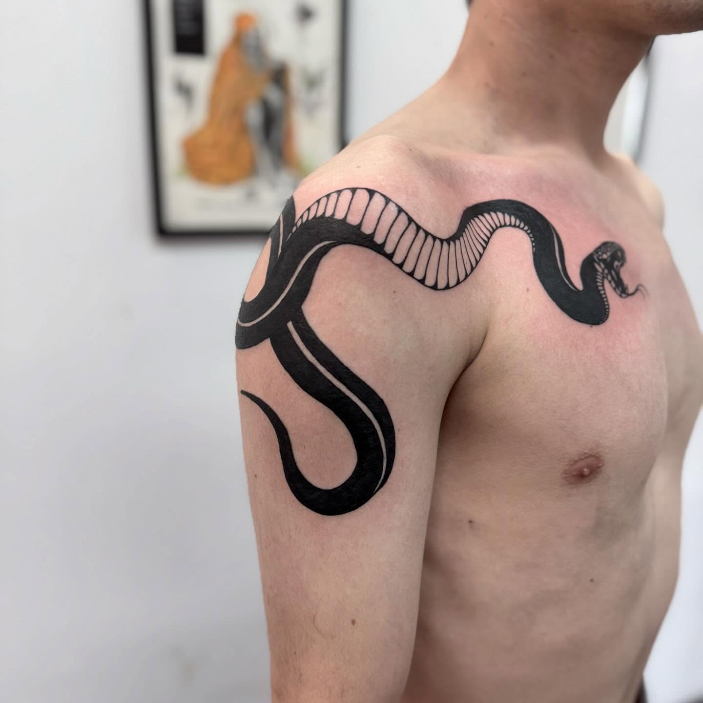 Snake black and grey tattoo on the shoulder by Han shinko, Portland, Oregon