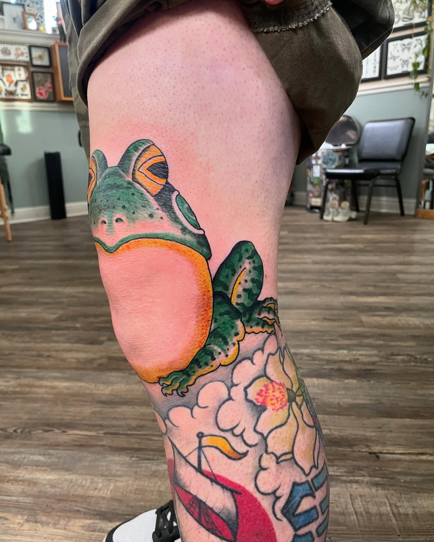 Frog American traditional tattoo on the thigh by Caleb Baker