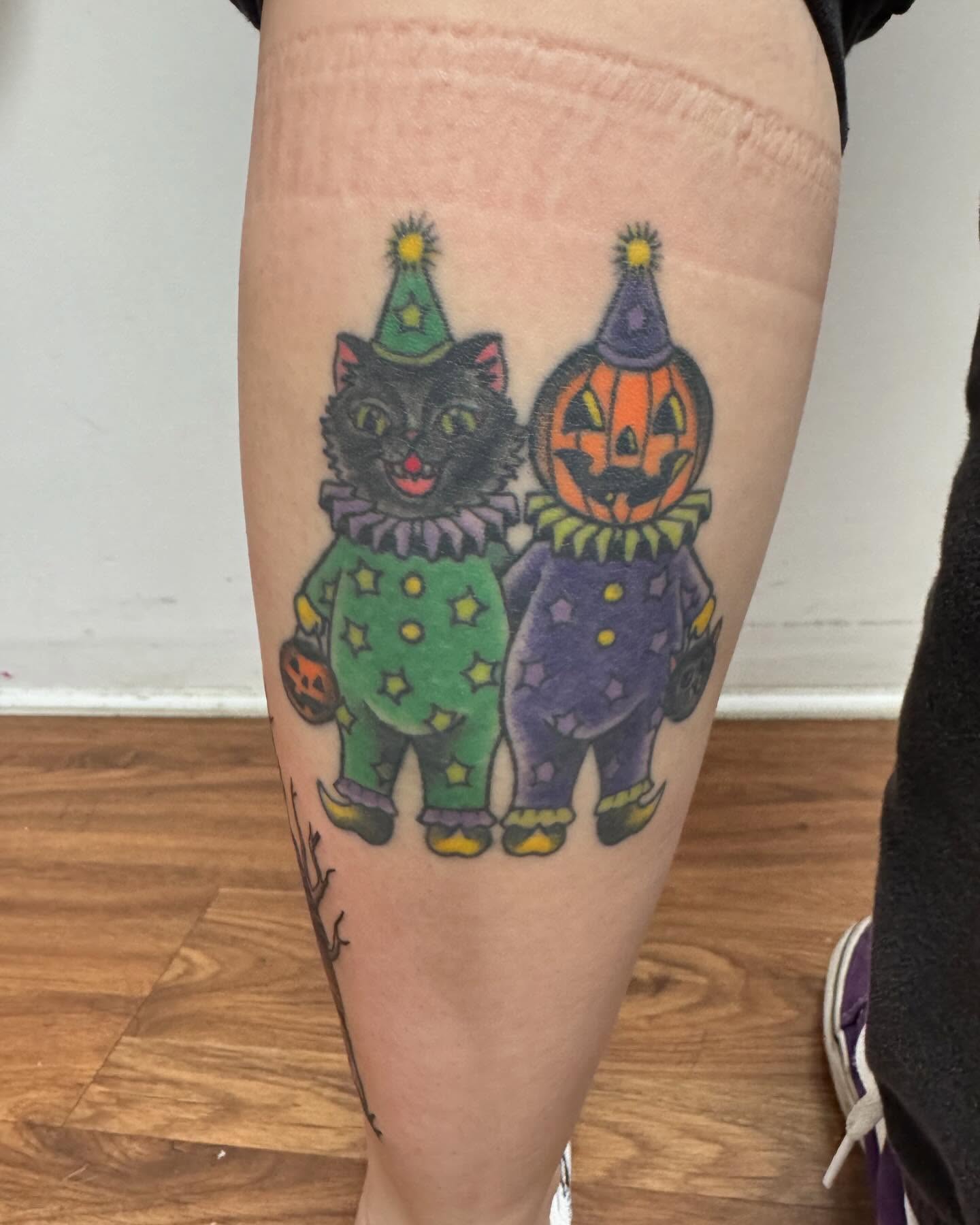 Clown cat and pumpkin American traditional tattoo on the thigh by McKenna Chalifoux