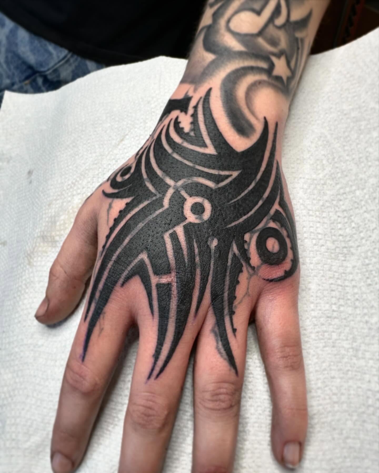 Tribal design tribal tattoo on the hand by Elijah Edwards
