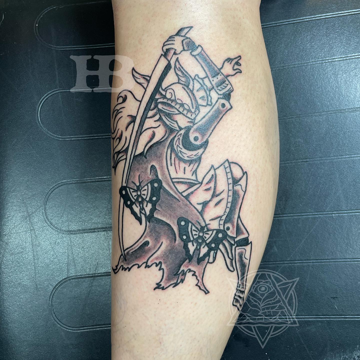 Warrior with sword black and grey tattoo on the forearm by Hunter Beyer