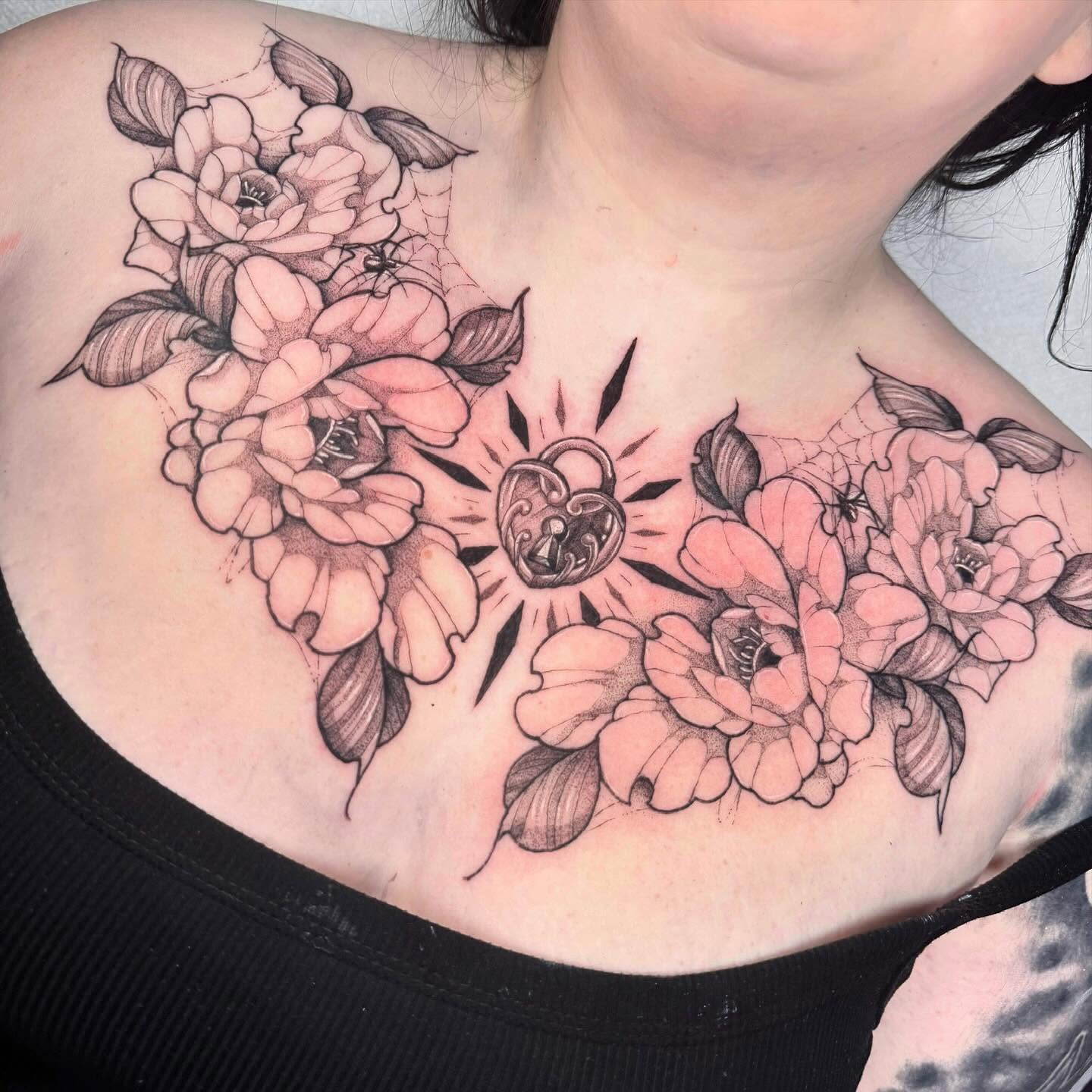 Floral bouquet realism tattoo on the chest by 𝔈𝔯𝔦𝔫 𝔊𝔦𝔩𝔩𝔦𝔩𝔞𝔫𝔡, Springfield, Ohio