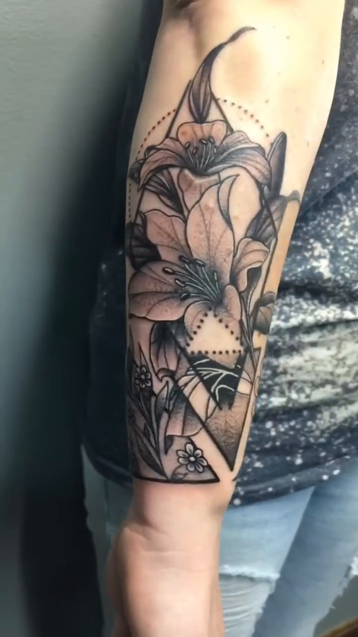 Floral and geometric design on forearm fine line tattoo on the forearm by Joshua Shawn